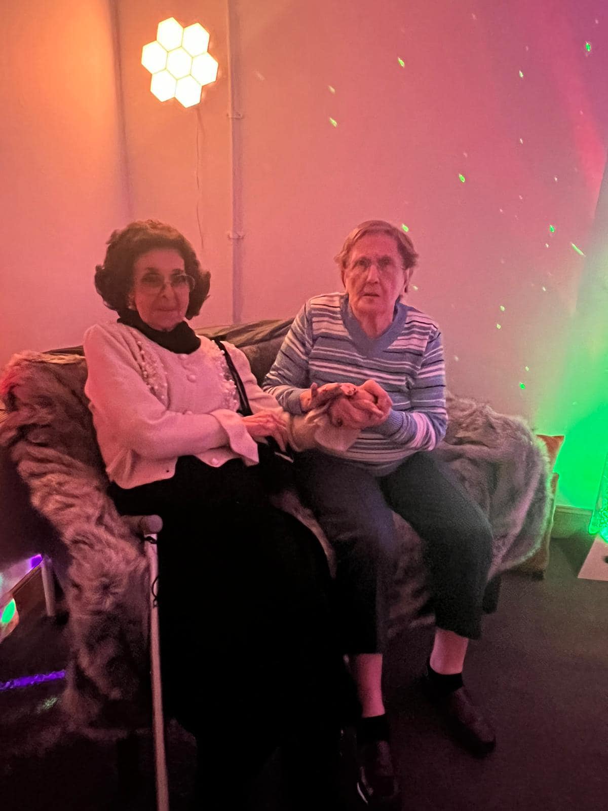Residents Holding Hands in Sensory Room