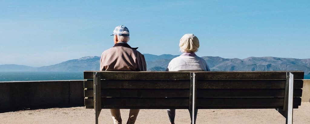 couple-sitting-on-beach