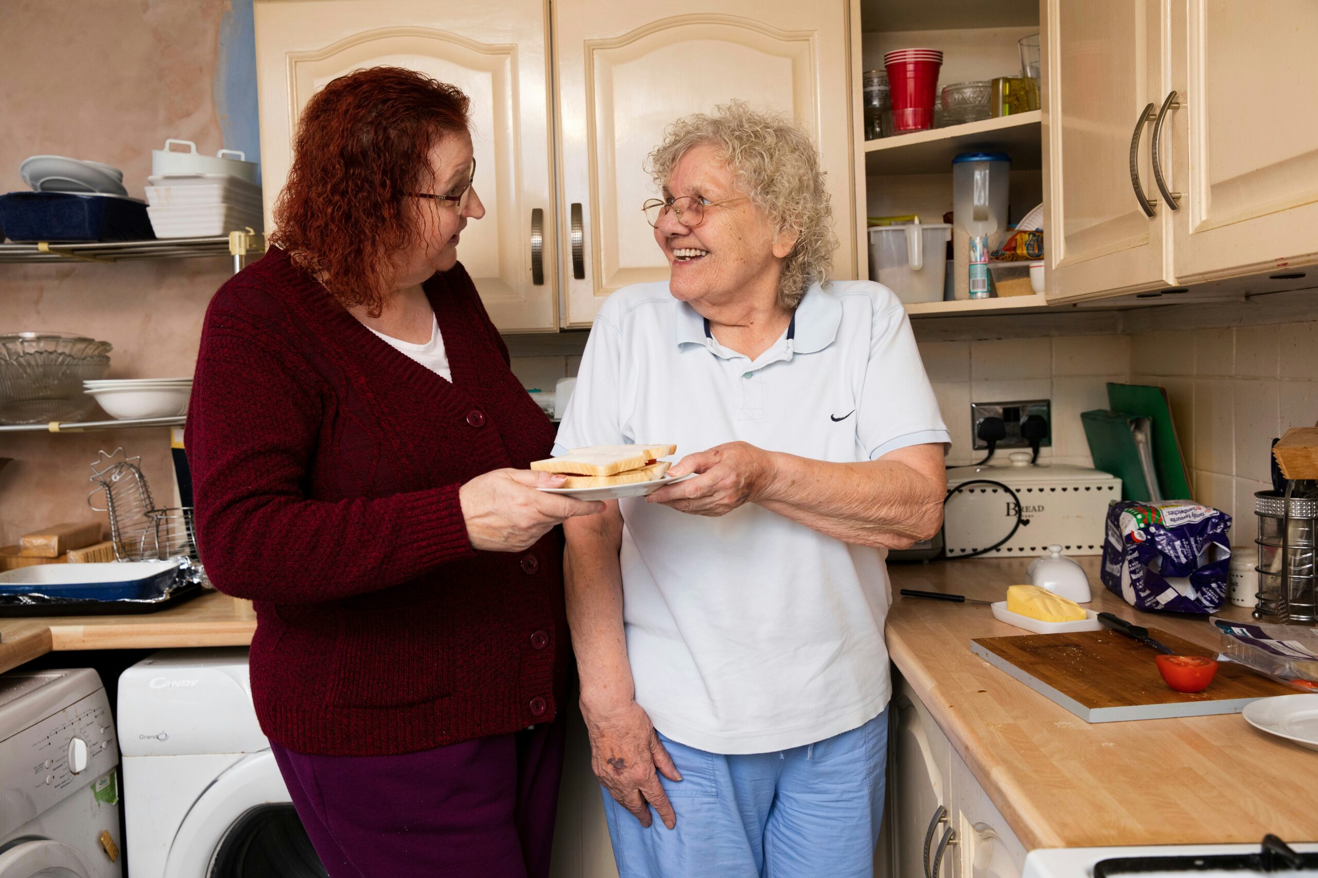 resident smiling with family member