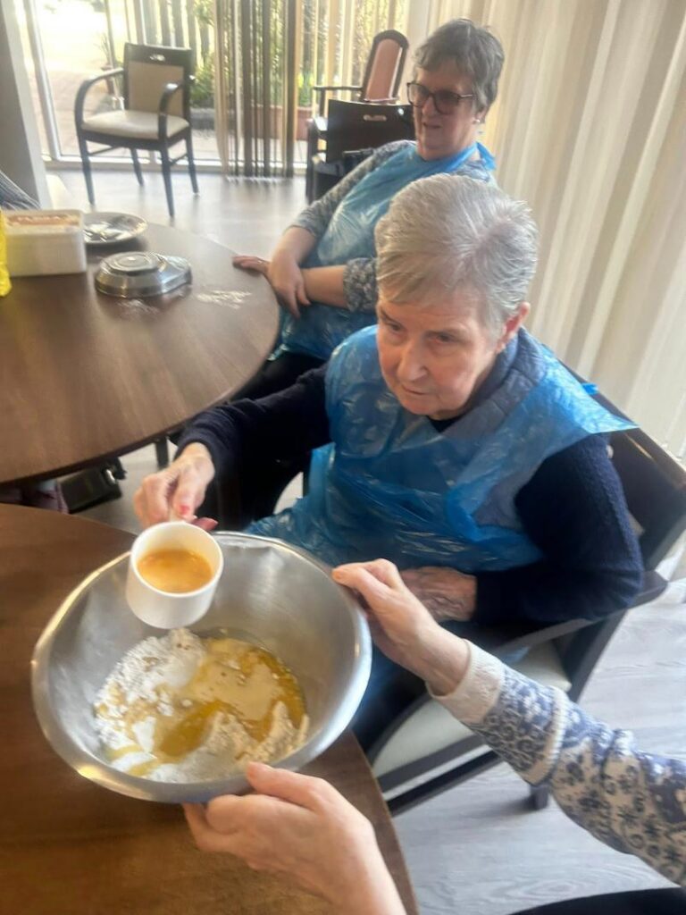 two older ladies baking
